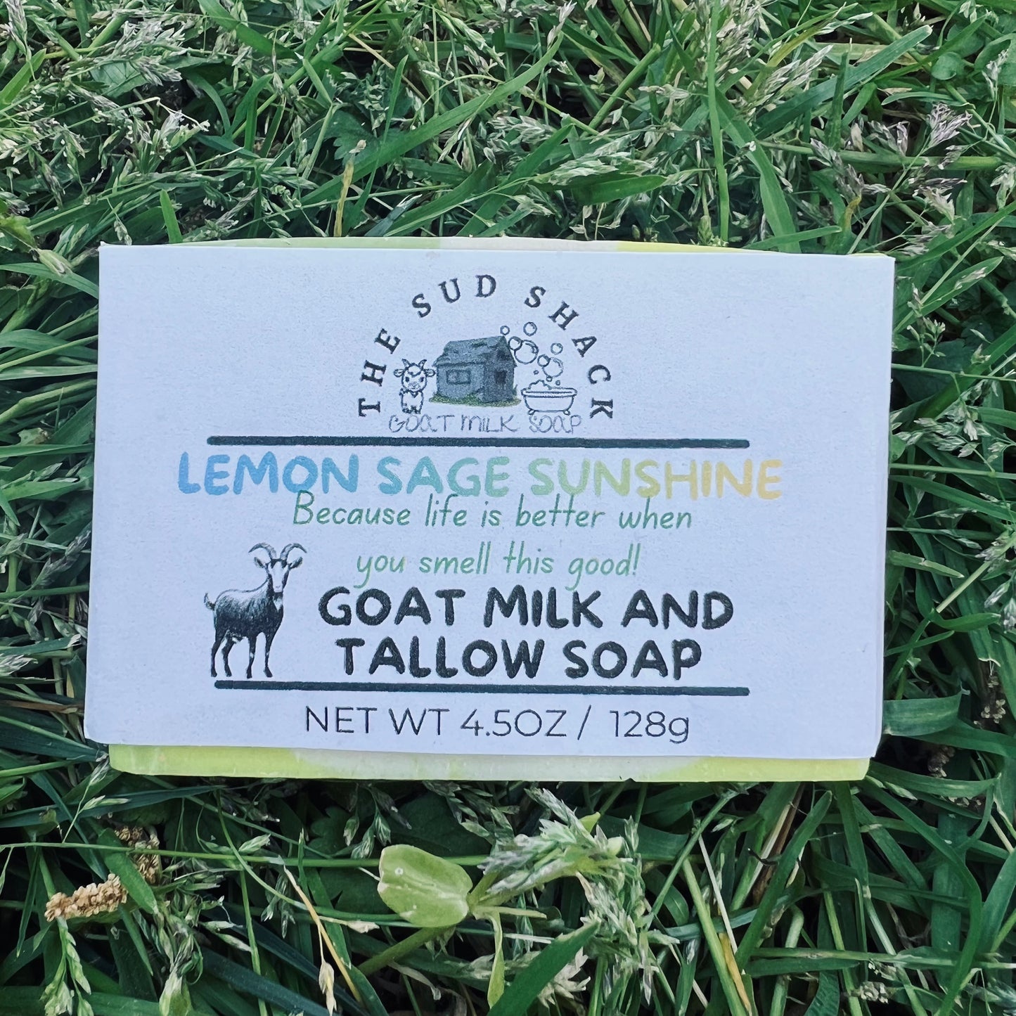 Bar of soap with 'The Sud Shack' branding on a grass background