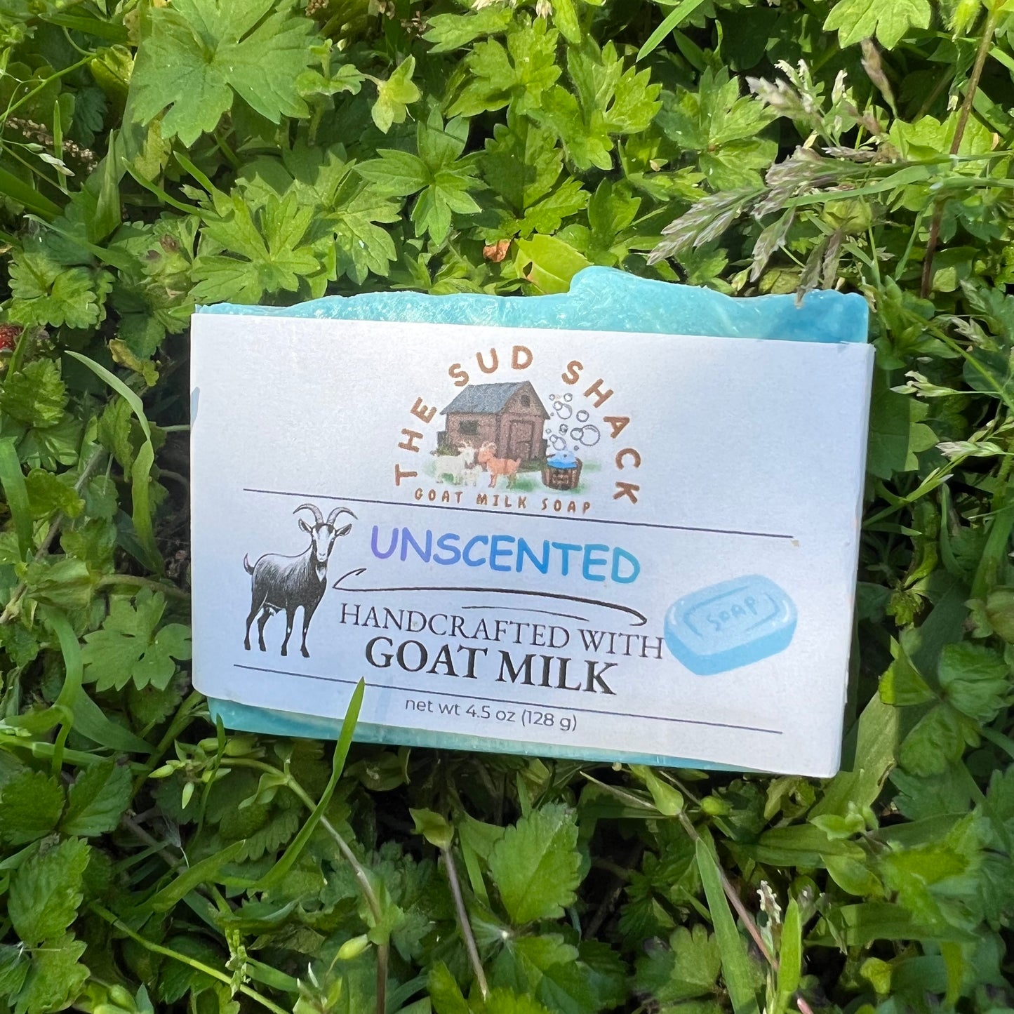 Bar of soap from The Sud Shack on a grass background
