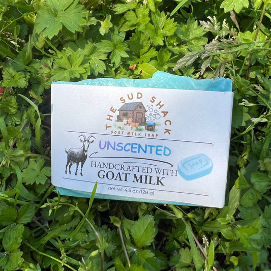 Bar of soap from The Sud Shack on a grass background