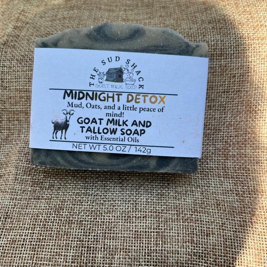 Bar of soap with a label on a textured fabric background