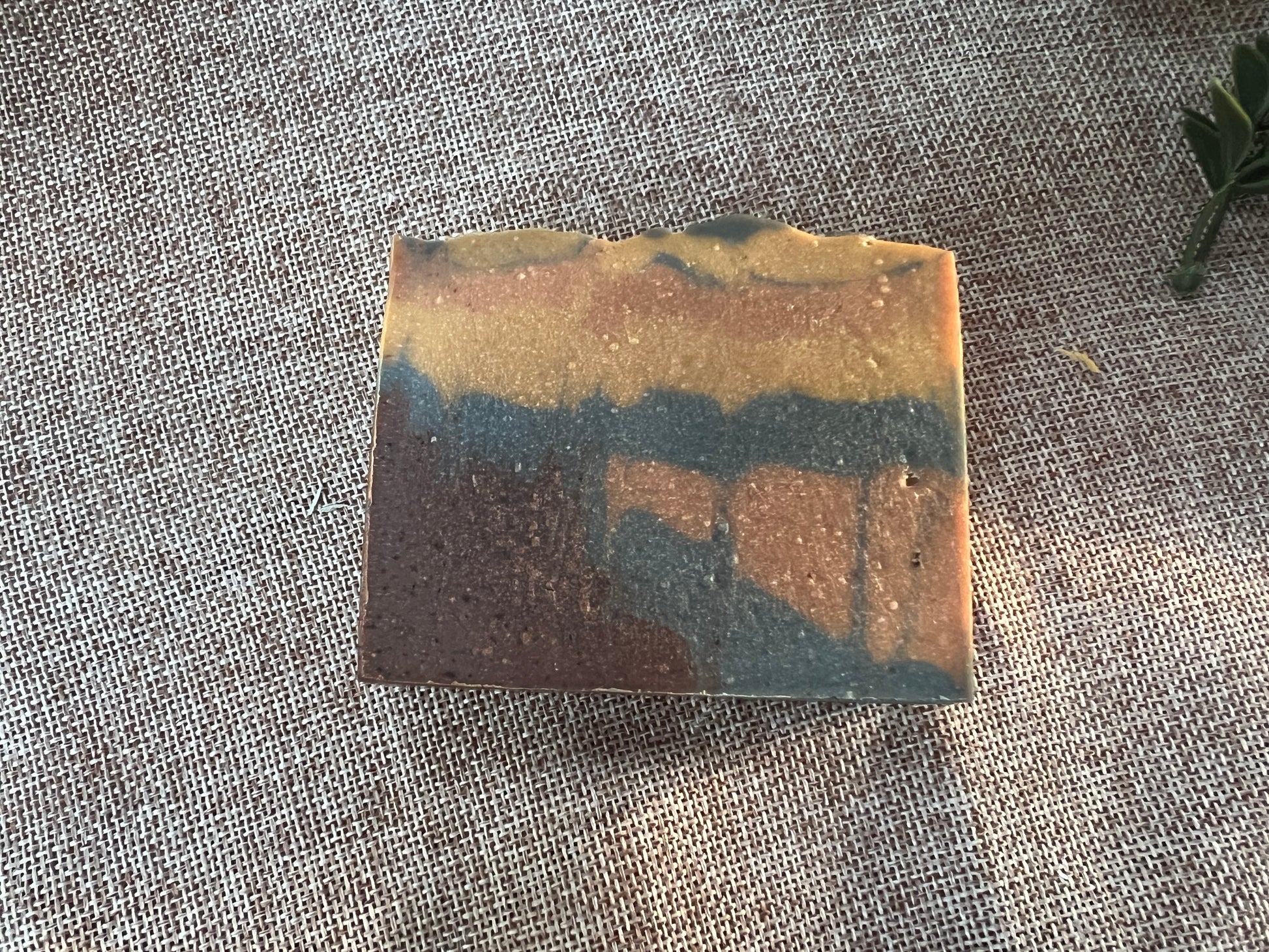 Colorful soap bar on a textured fabric background