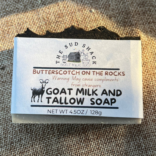 Bar of soap with a label on a textured fabric background