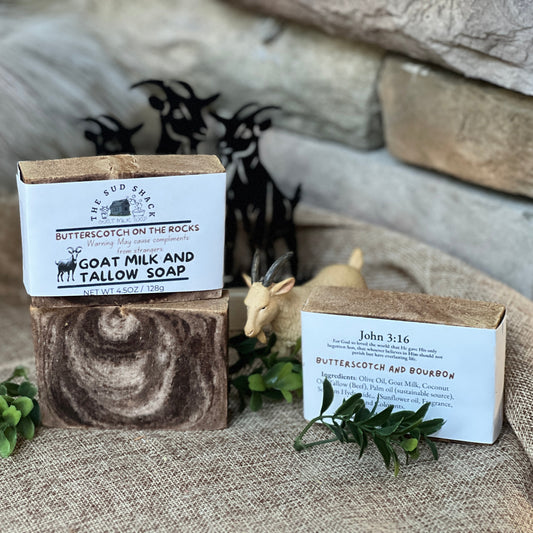 Goat milk and tallow soap with packaging on a rustic background