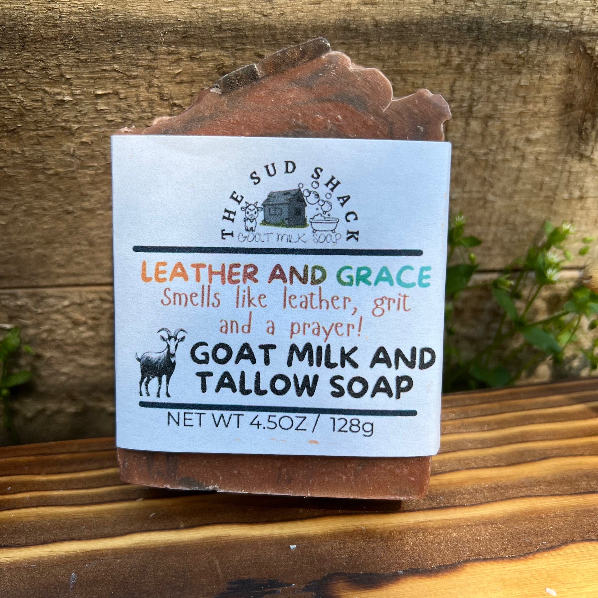 Bar of soap with a label on a wooden surface