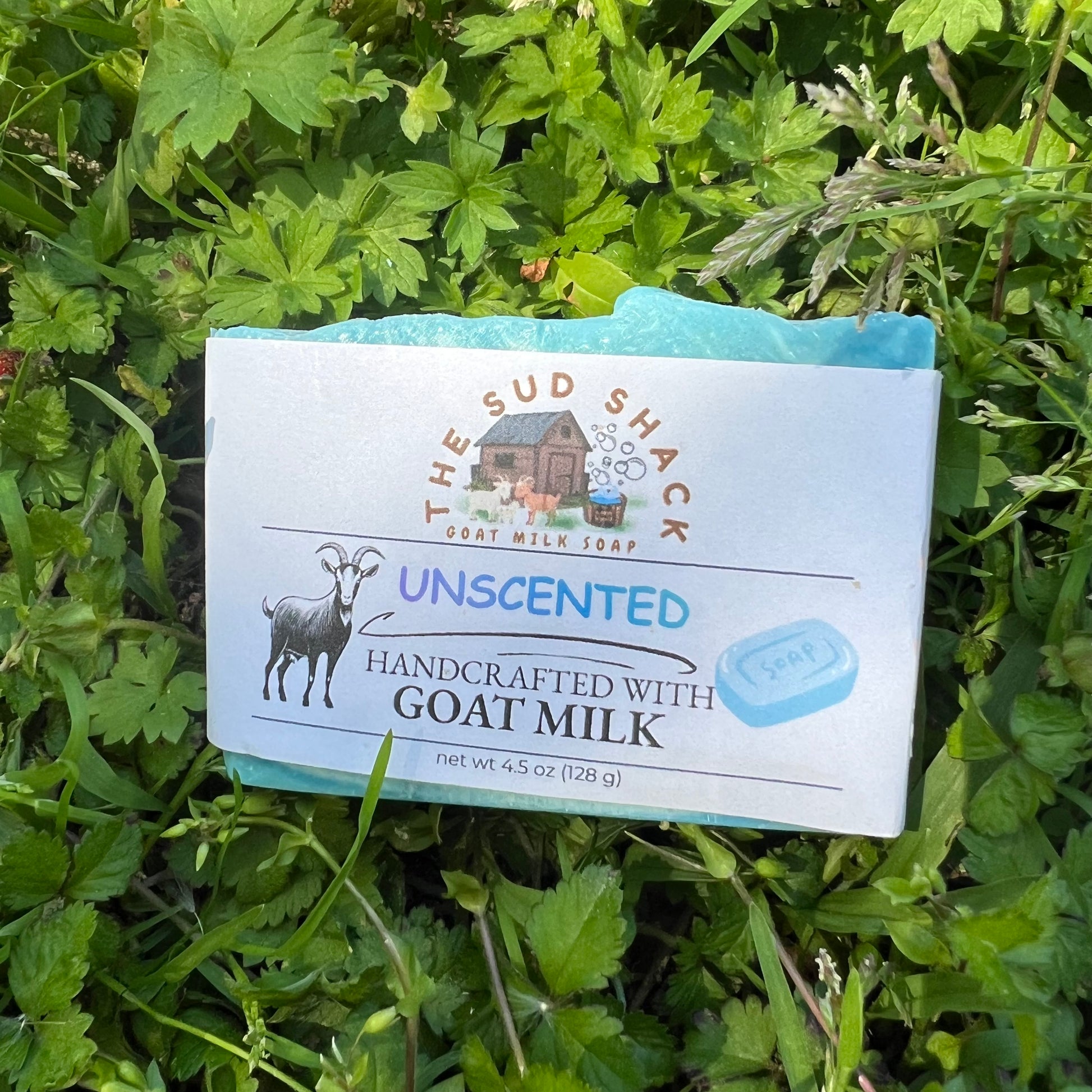 Bar of soap from The Sud Shack on a grass background