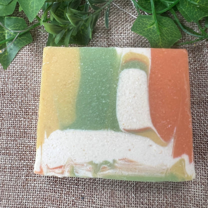 Colorful soap bar with a natural texture on a textured fabric background