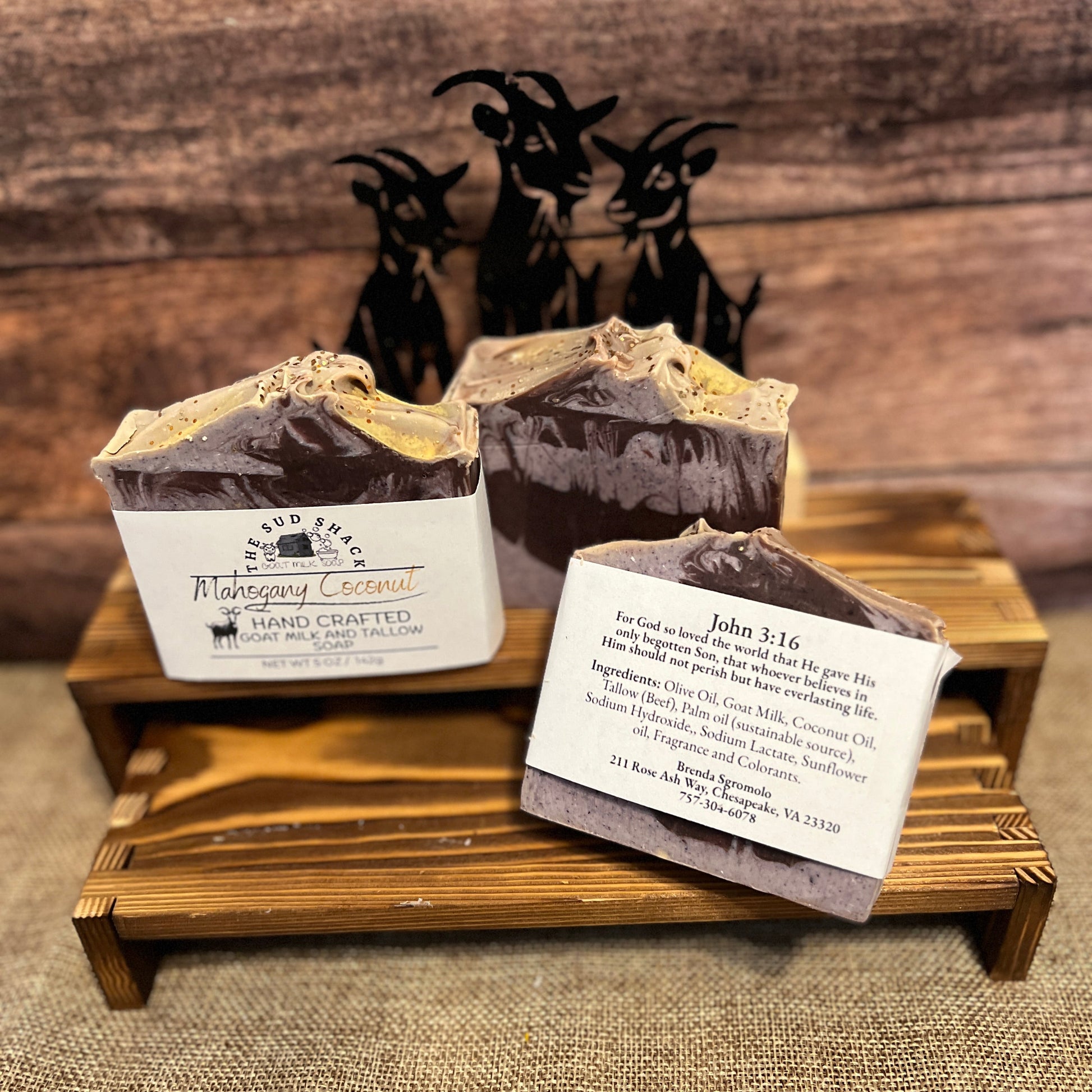 3 bars of soap on a wooden shelf with rustic background