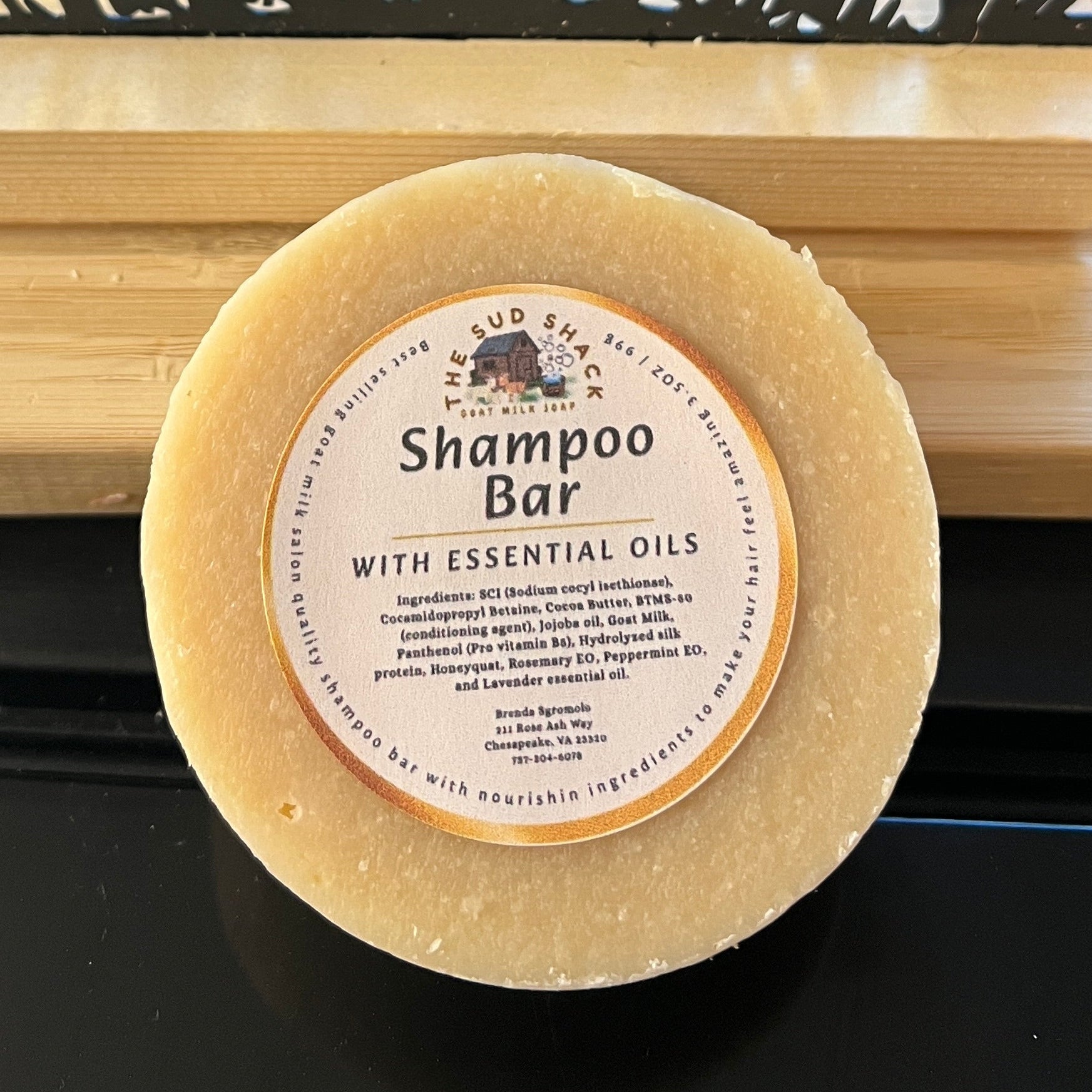 Shampoo bar on a wooden stand with goat design