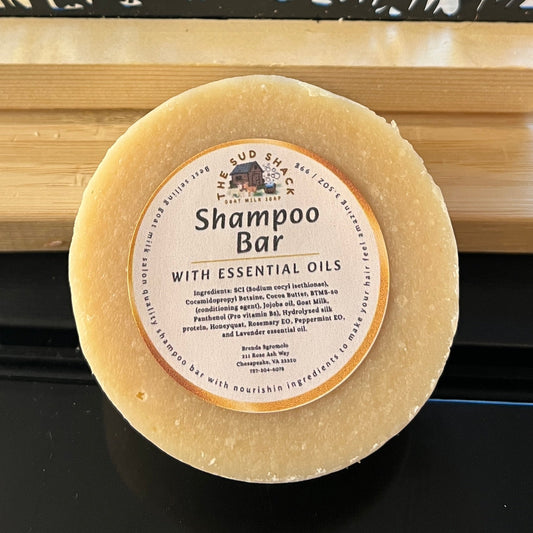 Shampoo bar on a wooden stand with goat design