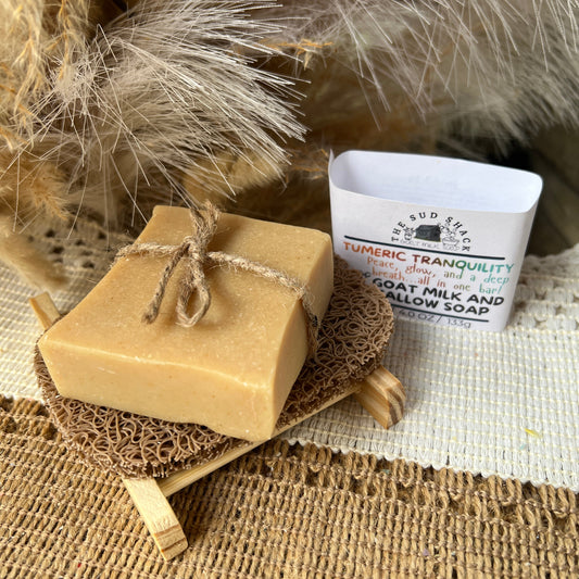 Bar of soap on a soap saver with rustic background an label